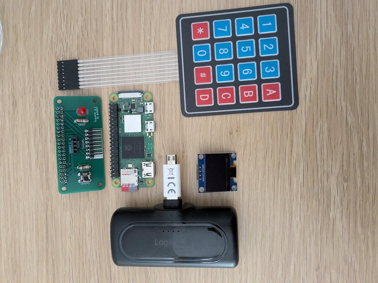 All components needed (hat, keyboard, screen, power bank and Raspberry Pi))