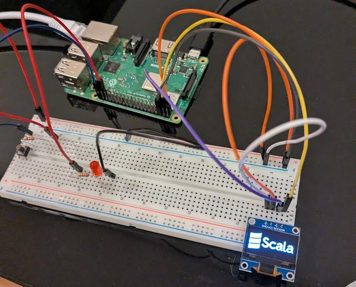 SSD1306 OLED display showing the Scala logo